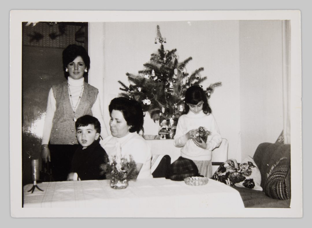 Ceferina García García with her children. The eldest daughter, Irene, worked at “Cramer und Meermann” and used her first salary to buy Christmas presents for the family. Cristina, the middle child, received a Steiff plush squirrel as a gift from her sister. Westfalenstraße 273, Essen-Steele, c. 1970 © Cristina Fernández-Moser